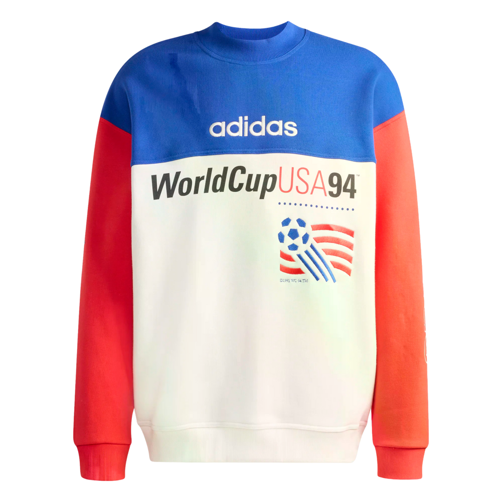 A color-blocked adidas sweatshirt commemorating World Cup USA 94. It features a blue upper panel with a white adidas logo, red sleeves, and a white lower section with the text "WorldCupUSA94" and the tournament's official soccer ball logo.