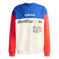 A color-blocked adidas sweatshirt commemorating World Cup USA 94. It features a blue upper panel with a white adidas logo, red sleeves, and a white lower section with the text "WorldCupUSA94" and the tournament's official soccer ball logo.