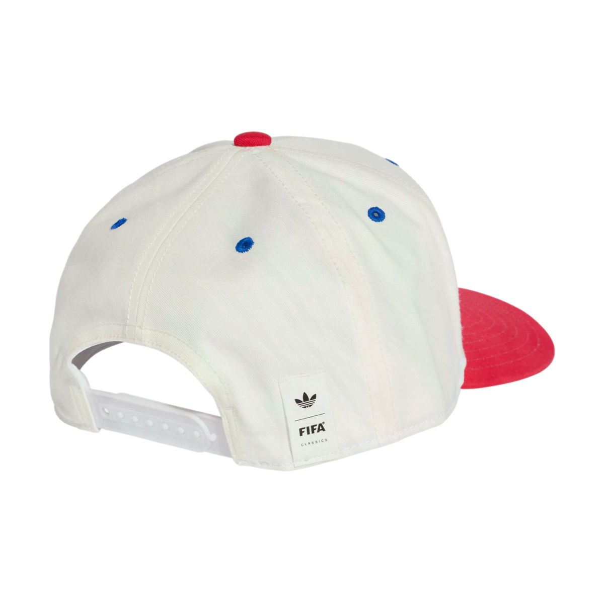 A rear view of a white six-panel baseball cap with blue embroidered eyelets and a red top button. A portion of the red brim is visible on the right side. It features a white snapback closure and a small white tag on the back with the Adidas trefoil logo a