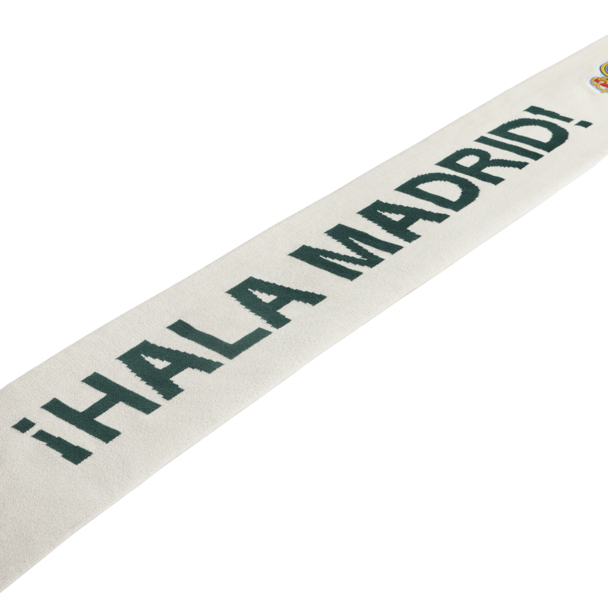 White scarf with dark green "¡HALA MADRID!" text and a small Real Madrid crest.