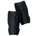 A pair of black Puma soccer shin guards with embossed leaping cat logos and curved ridges, set against a black background.