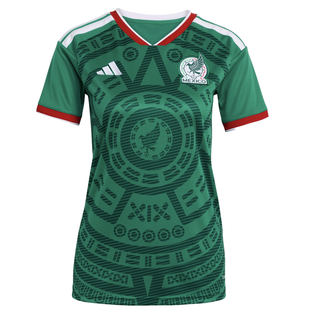A green Mexico national football team jersey featuring a prominent Aztec-inspired sun stone graphic, white Adidas logo, and team crest with red and white trim.