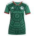 A green Mexico national football team jersey featuring a prominent Aztec-inspired sun stone graphic, white Adidas logo, and team crest with red and white trim.