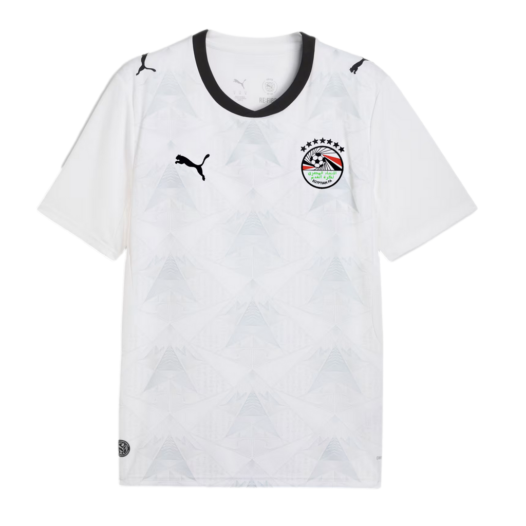 A white Puma Egypt national football team jersey with a subtle light gray geometric pyramid pattern across the front. It features a black crew neck collar, a black Puma logo on the right chest, and the Egyptian Football Association crest with seven stars 