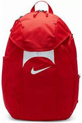 Red Nike backpack with a white swoosh logo on a central white panel, featuring multiple zippered compartments and a top handle.